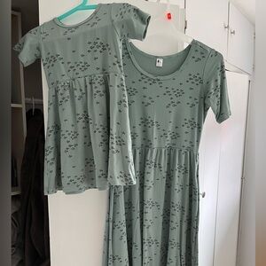 Matching little & lively fish dresses in EUC